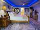Spacious bedroom featuring a queen-size bed, elegant lighting, and stylish decor at 5200 Brittany S Dr # 204, St Petersburg, FL 33715
