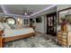 Bedroom with a statement floor, queen size bed, dresser, and flat screen television at 5200 Brittany S Dr # 204, St Petersburg, FL 33715