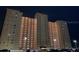 Night view of a high-rise building with ample parking, showcasing its modern architecture and convenient location at 5200 Brittany S Dr # 204, St Petersburg, FL 33715