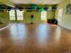 Spacious fitness room with hardwood floors, wall mirrors, and equipment for diverse workout routines at 5200 Brittany S Dr # 204, St Petersburg, FL 33715