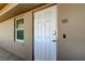 View of front door with digital entry lock, number 204, and adjacent window at 5200 Brittany S Dr # 204, St Petersburg, FL 33715