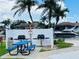 Outdoor grilling area with modern grills, picnic table, and scenic waterfront views for community enjoyment at 5200 Brittany S Dr # 204, St Petersburg, FL 33715