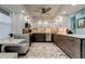 Modern kitchen with stainless steel appliances, white and gray cabinets, and stylish eat-in nook at 5200 Brittany S Dr # 204, St Petersburg, FL 33715