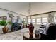 Well-lit living room featuring a large television, decorative accents, and expansive water views at 5200 Brittany S Dr # 204, St Petersburg, FL 33715