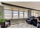 Cozy seating area with large windows providing stunning water views and natural light at 5200 Brittany S Dr # 204, St Petersburg, FL 33715