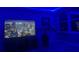 Modern living room with dim lighting, city views and a large TV at 5200 Brittany S Dr # 204, St Petersburg, FL 33715