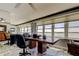 Bright office space featuring a large desk and stunning water views from expansive windows at 5200 Brittany S Dr # 204, St Petersburg, FL 33715