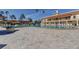 Large community swimming pool surrounded by lounge chairs and manicured landscaping for relaxation at 5200 Brittany S Dr # 204, St Petersburg, FL 33715