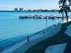 Scenic waterfront view featuring a pier and clear turquoise waters and community view at 5200 Brittany S Dr # 204, St Petersburg, FL 33715