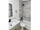 Updated bathroom with tile walls, shower-tub, modern vanity, black hardware, and neutral paint at 5340 Royal Palm Ave # 5340, Sarasota, FL 34234