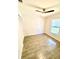 Light and airy bedroom features tile flooring, window, closet, and neutral paint at 5340 Royal Palm Ave # 5340, Sarasota, FL 34234