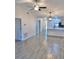 Bright and spacious living area with tile flooring leads to an open kitchen featuring recessed lighting and modern fixtures at 5340 Royal Palm Ave # 5340, Sarasota, FL 34234
