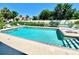 Community pool with lots of sunning deck and lounge chairs at 5340 Royal Palm Ave # 5340, Sarasota, FL 34234