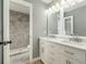Updated bathroom with dual sinks, marble counters, and shower at 5410 Treig Ln, Wesley Chapel, FL 33545