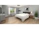 Stylishly furnished bedroom with a large window and decor at 5410 Treig Ln, Wesley Chapel, FL 33545