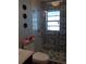 Beautiful bathroom with modern shower, mosaic tiles, and bright natural lighting at 5413 S Martin Ave, Tampa, FL 33611