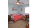 Inviting bedroom with a daybed, tropical artwork, and bright, cheerful decor at 5413 S Martin Ave, Tampa, FL 33611