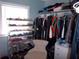 Spacious walk-in closet with extensive shelving and ample storage for shoes and clothing at 5413 S Martin Ave, Tampa, FL 33611