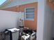 Image of a pool filtration and pump system enclosed within a white vinyl fence at 5413 S Martin Ave, Tampa, FL 33611