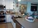 Beautiful kitchen featuring a breakfast bar with luxury counter tops and stainless appliances at 5413 S Martin Ave, Tampa, FL 33611