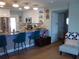 Modern kitchen with stainless steel appliances, breakfast bar and bright lighting at 5413 S Martin Ave, Tampa, FL 33611