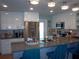 Bright kitchen with stainless steel appliances, breakfast bar, and ample storage at 5413 S Martin Ave, Tampa, FL 33611
