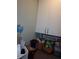 Laundry room with storage cabinets, laundry supplies, and organization solutions at 5413 S Martin Ave, Tampa, FL 33611