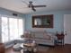 Cozy living room featuring a comfortable sectional sofa and stylish decor at 5413 S Martin Ave, Tampa, FL 33611