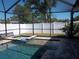 Relaxing screened-in pool with spa and spacious patio area at 5413 S Martin Ave, Tampa, FL 33611