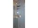 Modern bathroom shower featuring tiled walls and built-in shelving for toiletries at 5413 S Martin Ave, Tampa, FL 33611