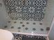 Shower featuring glass door, patterned tile flooring, and matching tile surround at 5413 S Martin Ave, Tampa, FL 33611