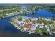Aerial view showing the waterfront community, waterways and many boat docks at 5449 Manatee Point Dr, New Port Richey, FL 34652