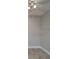 Minimalist bedroom with tile floors, ceiling fan and neutral walls at 5449 Manatee Point Dr, New Port Richey, FL 34652