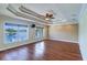 Bright living room boasting wood floors, a custom ceiling, and large windows revealing beautiful waterfront views at 5449 Manatee Point Dr, New Port Richey, FL 34652