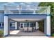 Covered outdoor patio with seating beneath a balcony, offering a relaxing space with water views at 5449 Manatee Point Dr, New Port Richey, FL 34652