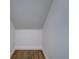 Well-lit storage nook with wood floor and white walls, perfect for organization at 5449 Manatee Point Dr, New Port Richey, FL 34652