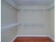 Empty walk-in closet with wire shelving installed, ready for customizable storage solutions at 5449 Manatee Point Dr, New Port Richey, FL 34652