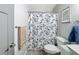 Bathroom featuring a modern vanity, commode, and shower with leaf pattern curtain at 5509 Fountain Lake Cir # C209, Bradenton, FL 34207