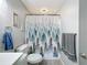Bathroom featuring forest-themed shower curtain and gray walls at 5509 Fountain Lake Cir # C209, Bradenton, FL 34207