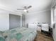 This bedroom features a ceiling fan, closet, and work space at 5509 Fountain Lake Cir # C209, Bradenton, FL 34207