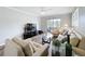 Cozy living room with neutral décor, updated flooring, and access to a private balcony at 5509 Fountain Lake Cir # C209, Bradenton, FL 34207