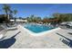 Community pool with lounge chairs and clear blue water at 5509 Fountain Lake Cir # C209, Bradenton, FL 34207