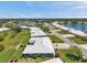 Scenic aerial shot displays community homes, lush greenery, and peaceful lake views at 6524 11Th W Ave # 5611, Bradenton, FL 34209