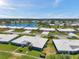 A high angle aerial picture showcasing the community's attractive homes and tranquil lake at 6524 11Th W Ave # 5611, Bradenton, FL 34209