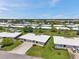 Well-maintained community homes with lush landscaping, green lawns, and ample parking at 6524 11Th W Ave # 5611, Bradenton, FL 34209