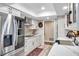 Well-lit kitchen with modern appliances, white cabinets and a stylish mosaic backsplash at 6524 11Th W Ave # 5611, Bradenton, FL 34209