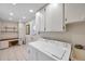 Spacious laundry room equipped with overhead cabinets, a counter for folding, and ample storage solutions at 6524 11Th W Ave # 5611, Bradenton, FL 34209