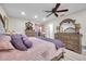 Comfortable main bedroom featuring a decorative mirror over wood dressers and soft, inviting bedding at 6524 11Th W Ave # 5611, Bradenton, FL 34209