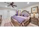 Well-lit main bedroom with a ceiling fan, hardwood floors, and comfortable furnishings at 6524 11Th W Ave # 5611, Bradenton, FL 34209