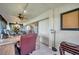 Office view with a leather chair, side table and views of the sunroom at 6524 11Th W Ave # 5611, Bradenton, FL 34209